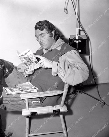 Glenn Langan relaxes between takes of film Forever Amber 45fa-31
