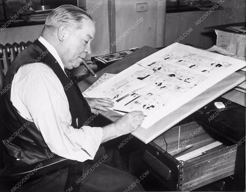 cartoonist George McManus at his desk making funny pages 4b09-073