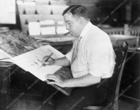 cartoonist George McManus at his desk making funny pages 4b09-074
