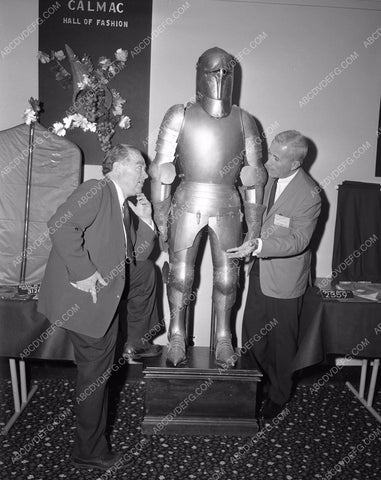 historic suit of armor inspected by two fellows 4b10-089