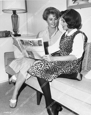 candid Shirley Jones and Carolyn Jones reading the newspaper between takes 5096-32