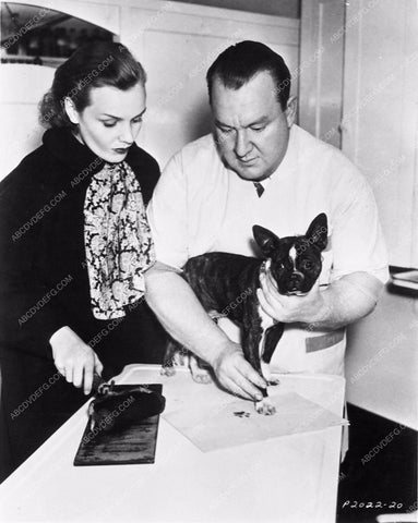 candid Frances Farmer gets her dog Bozo paw prints taken 5118-33