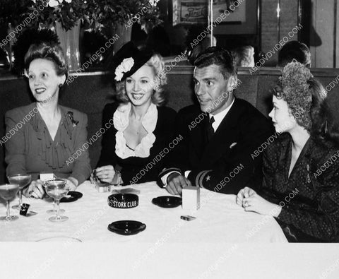 Carole Landis and friends dine at the Stork Club restaurant 5481-05