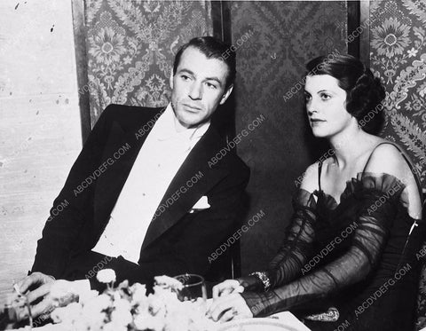 candid Gary Cooper dining with his wife I think 5599-03