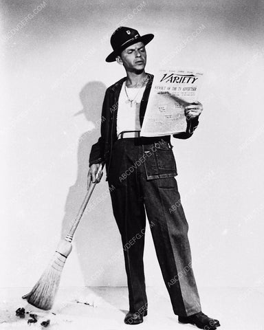 candid Frank Sinatra reading Variety and sweeping up on set From Here to Eternity 5599-22