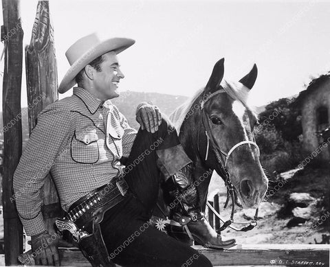 handsome cowboy Charles Starrett posing with his horse 5717-34