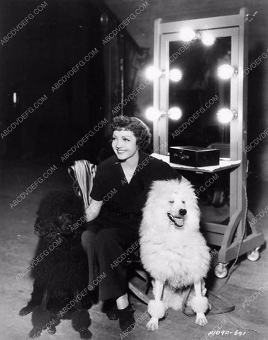 candid Claudette Colbert on set with her two dogs 5765a-13