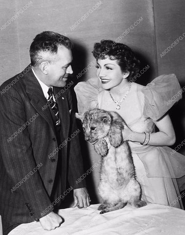 director W.S. Van Dyke Claudette Colbert and a lion cub 5765a-15