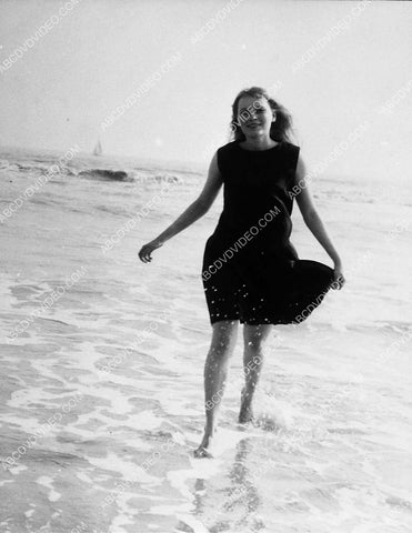 Mia Farrow standing in the surf 6300-15