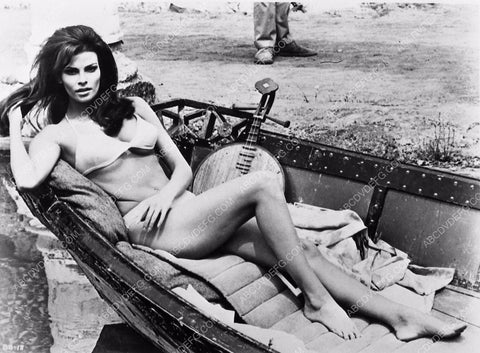 sexy Raquel Welch laying in a boat in her bikini film Fathom 6549-04