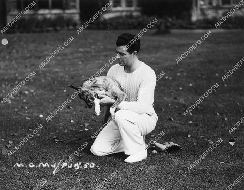 candid Robert Taylor playing w his dog 6628-07