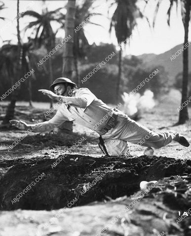 jumping for the foxhole film Back to Bataan 6951-07