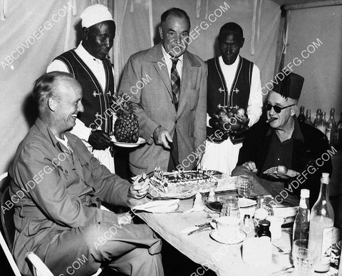 Wingate Smith Robert Surtees give John Ford birthday cake on location film Mogambo 7388-36