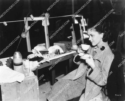 Maureen O'Sullivan enjoys a cup of coffee 8245-34