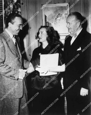 candid Bette Davis w some studio execs I think 8444-30