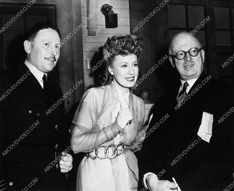 candid Irene Dunne and some studio execs 8730-14