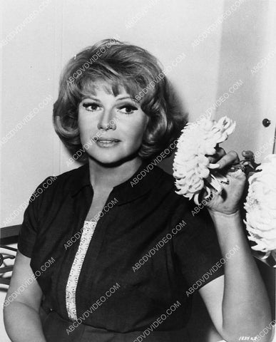 Rita Hayworth admiring the flowers 8832-34