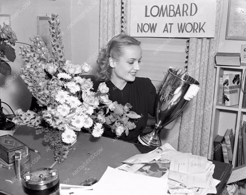 Carole Lombard in her office with trophy 8b03-553