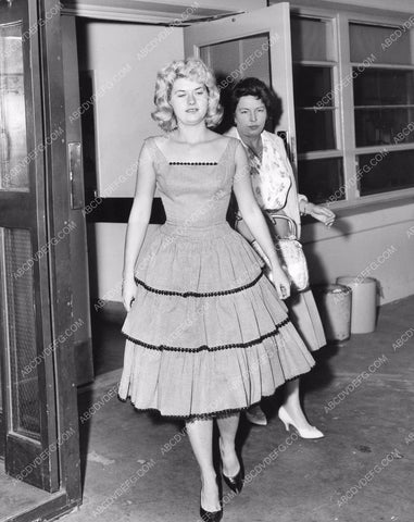 Beverly Aadland and officer leaving juvenile court 8b6-681