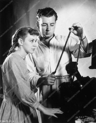 Ann Shirley behind the scenes looking at film dailies 9367-08