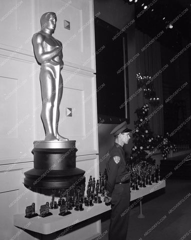 1955 Oscars guard watching over coveted statues Academy Awards aa1955-34</br>Los Angeles Newspaper press pit reprints from original 4x5 negatives for Academy Awards.