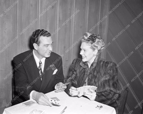 candid Alice Faye and Phil Harris playing cards afaye-08
