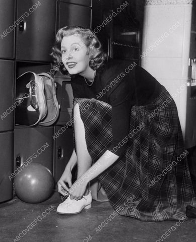 Arlen Dahl puts her bowling shoes on so she can play 8b20-0046
