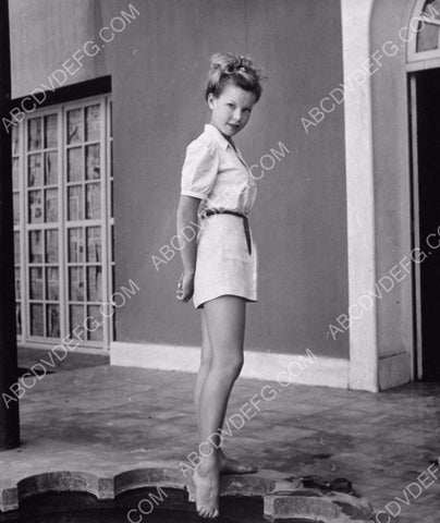 Cecile Aubrey sticks her barefoot in the water 8b20-0117