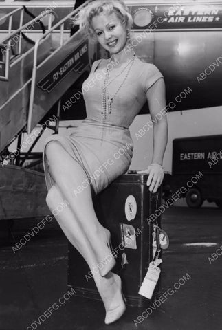 Greta Thyssen strikes a sexy pose on her luggage Eastern Airlines 8b20-0264