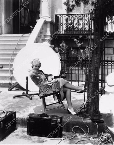 Maureen O'Sullivan relaxes between takes on the set 8b20-0470