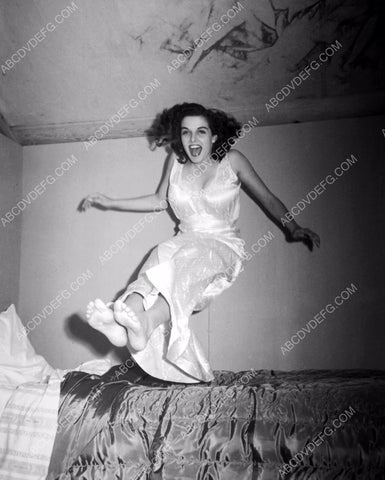 playful Jane Russell jumping on the bed 8b20-10050