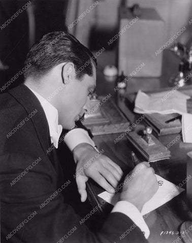 Cary Grant working at his desk 8b20-10546