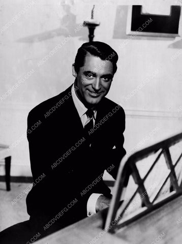 Cary Grant sitting at the piano 8b20-10588