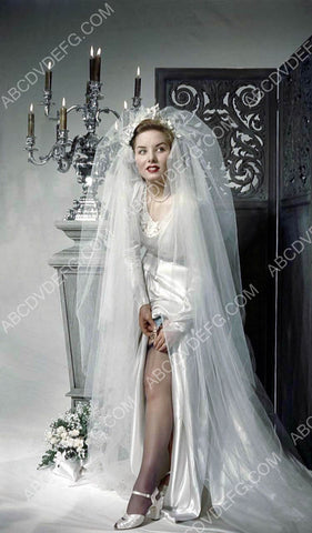 beautiful Colleen Townsend adjusts her bridal gown garter 8b20-10832