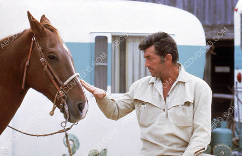 Dean Martin pets a horse outside his trailer 8b20-10889