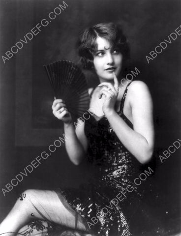 pre-code Barbara Stanwyck sitting with hand fan 8b20-11779