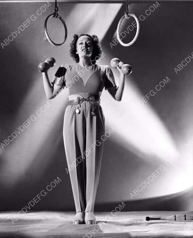 athletic Gloria Swanson working out with the dumb bells 8b20-12392