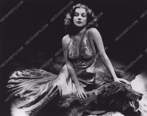 Ann Sheridan sitting on bearskin rug 8b20-12437
