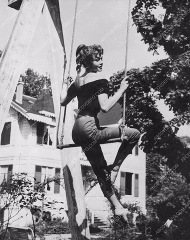 beautiful Brigitte Bardot playing on the swing set 8b20-12792