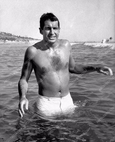 George Hamilton standing in the waves at the beach 8b20-12927