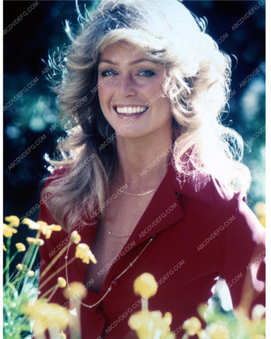 beautiful Farrah Fawcett standing in the flowers 8b20-13520