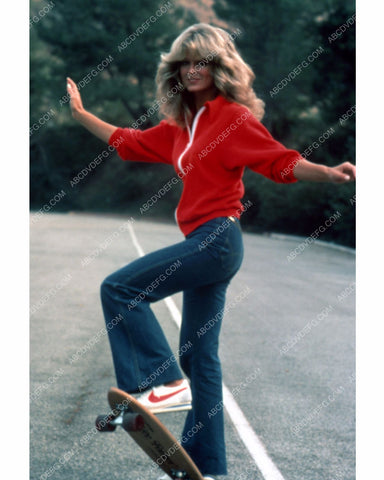 athletic Farrah Fawcett busting some moves on the skateboard 8b20-13530