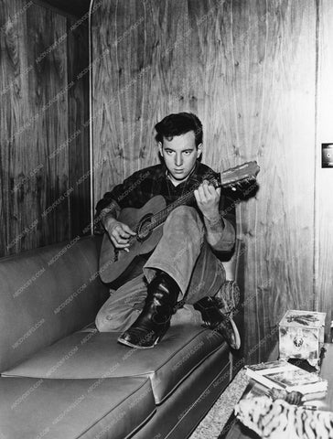 candid Bobby Darin strumming the guitar in his dressing room 8b20-13781