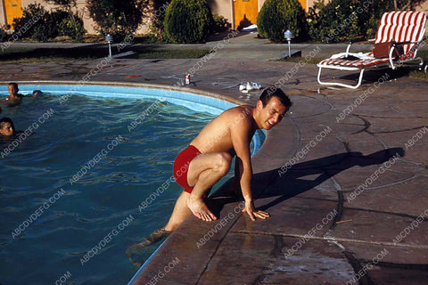 candid Bobby Darin climbing out of the swimming pool 8b20-13794