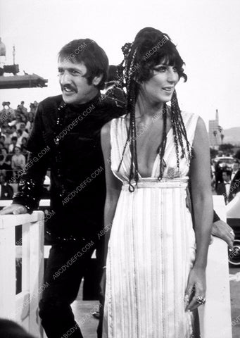 candid Sonny Bono Cher arrive at some outdoor event 8b20-14031
