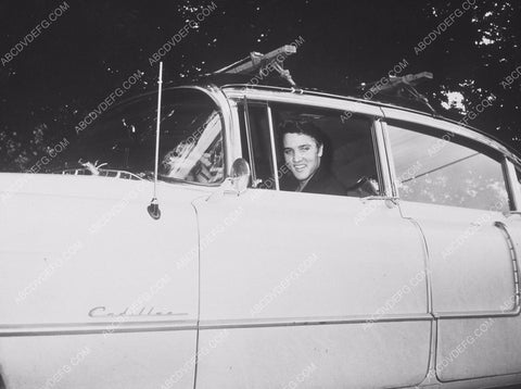 studly Elvis Presley in one of his many Cadillacs 8b20-14582