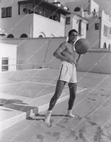 handsome and athletic Cary Grant playing on the beach in his socks 8b20-14711