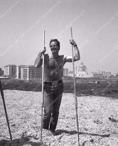 shirtless Charlton Heston outdoors on the set 8b20-15003
