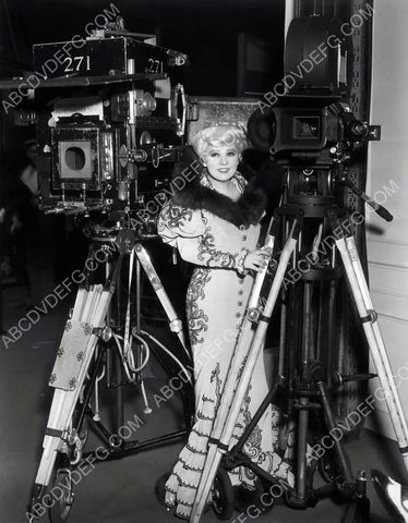 Mae West checks out the cameras behind scenes Belle of the Nineties 8b20-1575