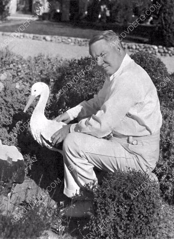 W.C. Fields sitting in the garden 8b20-16070
